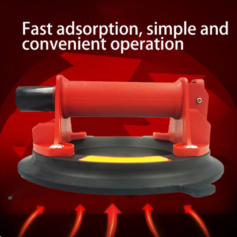 Un levier à ventouse haute capacité rouge avec des ventouses en bas, démontrant une adsorption rapide.