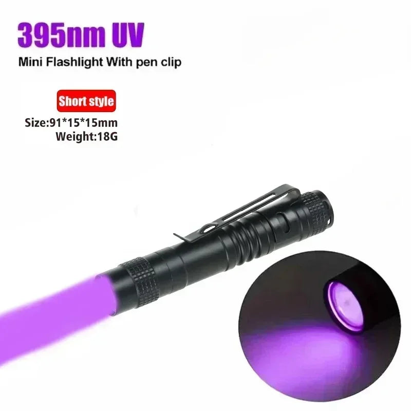 A black UV flashlight pen light with a purple beam, shown in a close-up view.