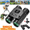 A black 500x25 5000m/50000m high-power folding binoculars with a tripod mount and accessory.
