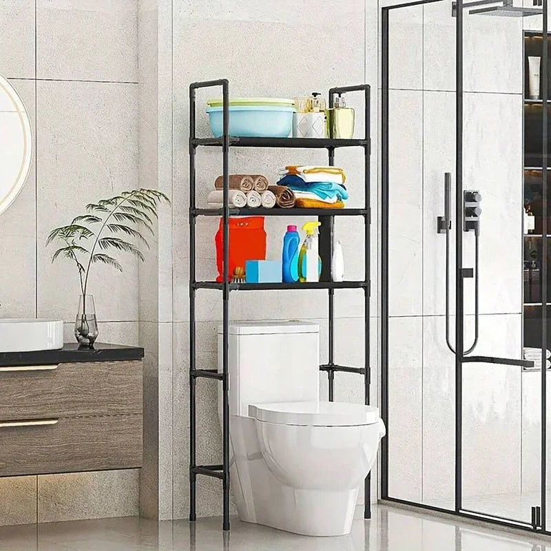 A black multi-layer bathroom storage rack holding various toiletries and a toilet bowl.