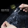 Hands are applying or handling a clear double-sided mounting tape, showing it is washed and dry and ready to use.