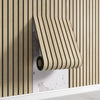 A roll of light wood-toned wooden grid wall stickers is mounted on a vertical wooden slat wall.