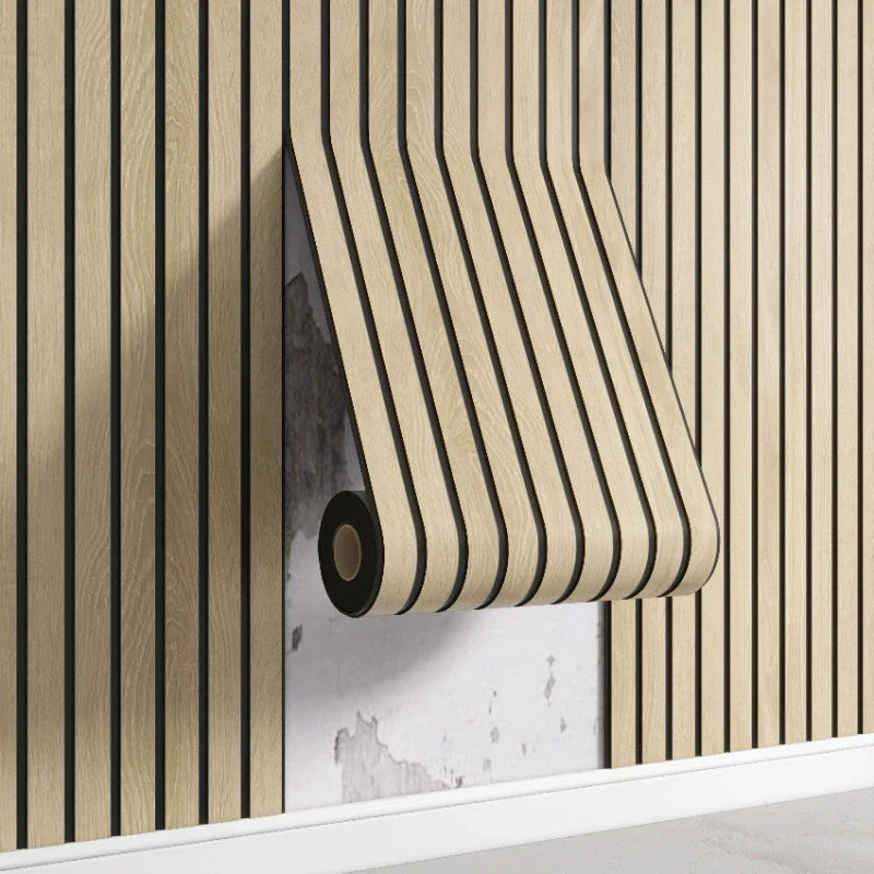 A roll of light wood-toned wooden grid wall stickers is mounted on a vertical wooden slat wall.