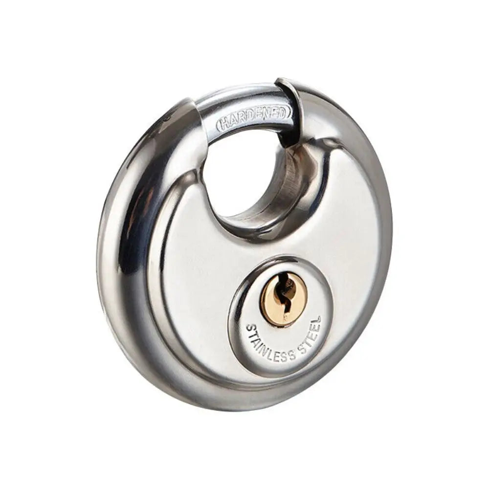 A close-up view of a heavy duty stainless steel round padlock with a keyhole and a hardened shackle.