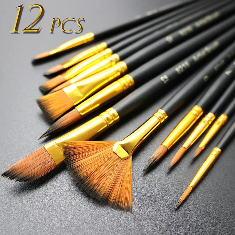 A set of twelve black nylon flat brushes with gold ferrules laid out on a dark surface.