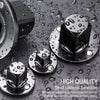 A set of four black precision impact socket adapters made of corrosion-resistant chrome vanadium steel resting on a wet, dark