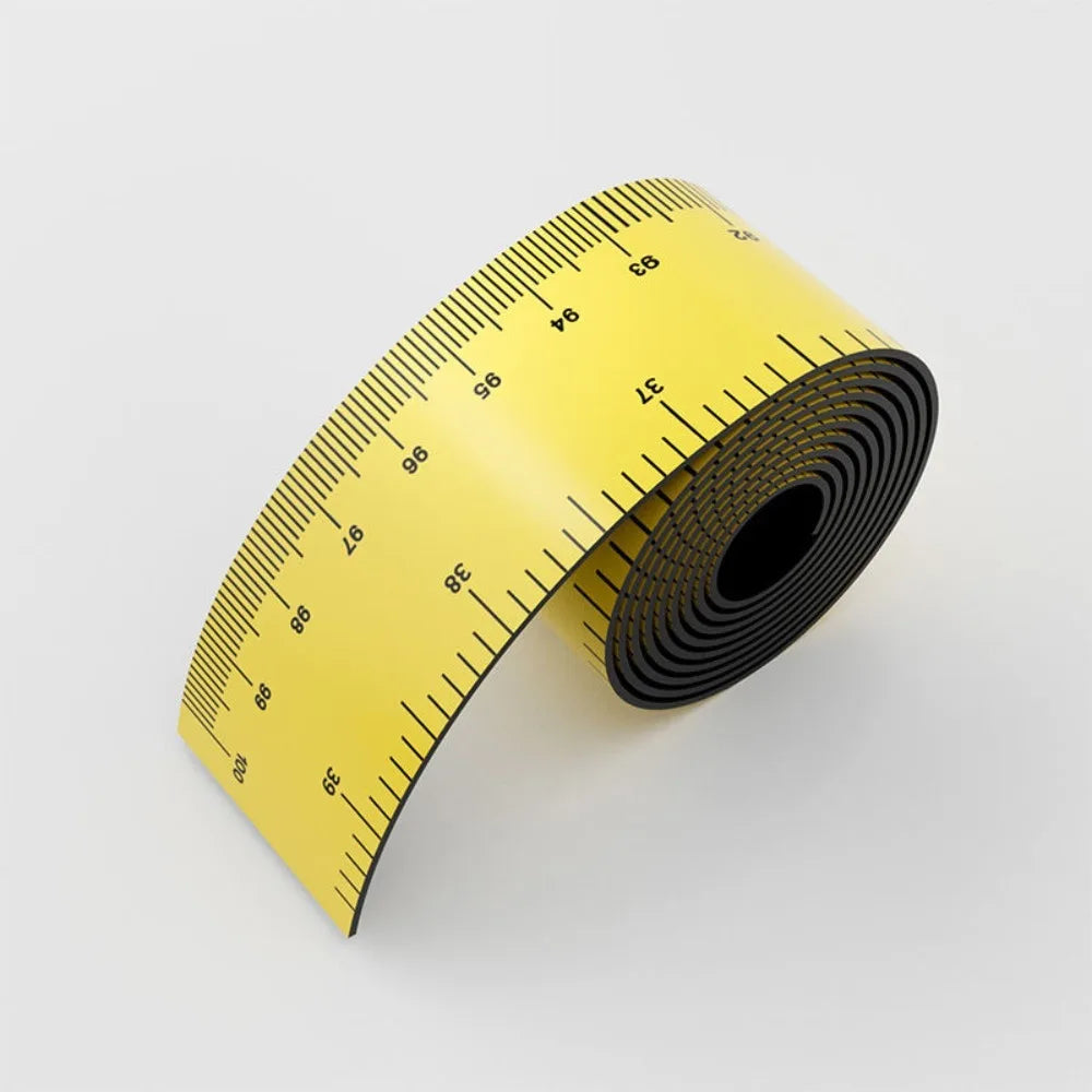 A yellow flexible measuring ruler coiled on a white background.