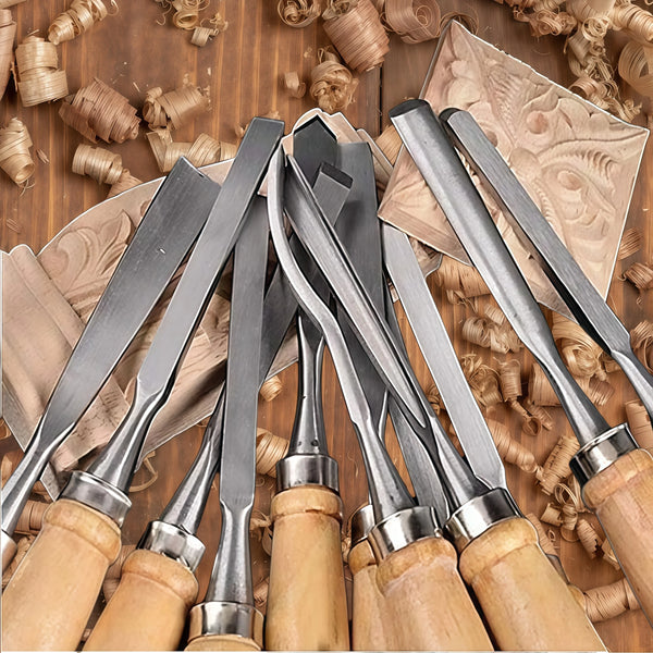 A set of twelve metal carving chisels with wooden handles laid out on a brown surface.