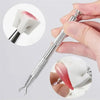A hand holds a silver nail art sponge set with a gripping pen, showing the sponge and tip.