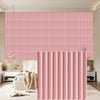 Pink vertical fluted PVC wall panels used as interior decor