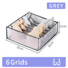 Grey fabric storage organizer box with six grids for storing items like underwear or accessories