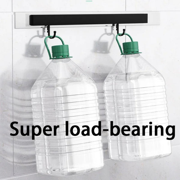 Two clear plastic bottles with green caps are hanging from a white mounting bracket.