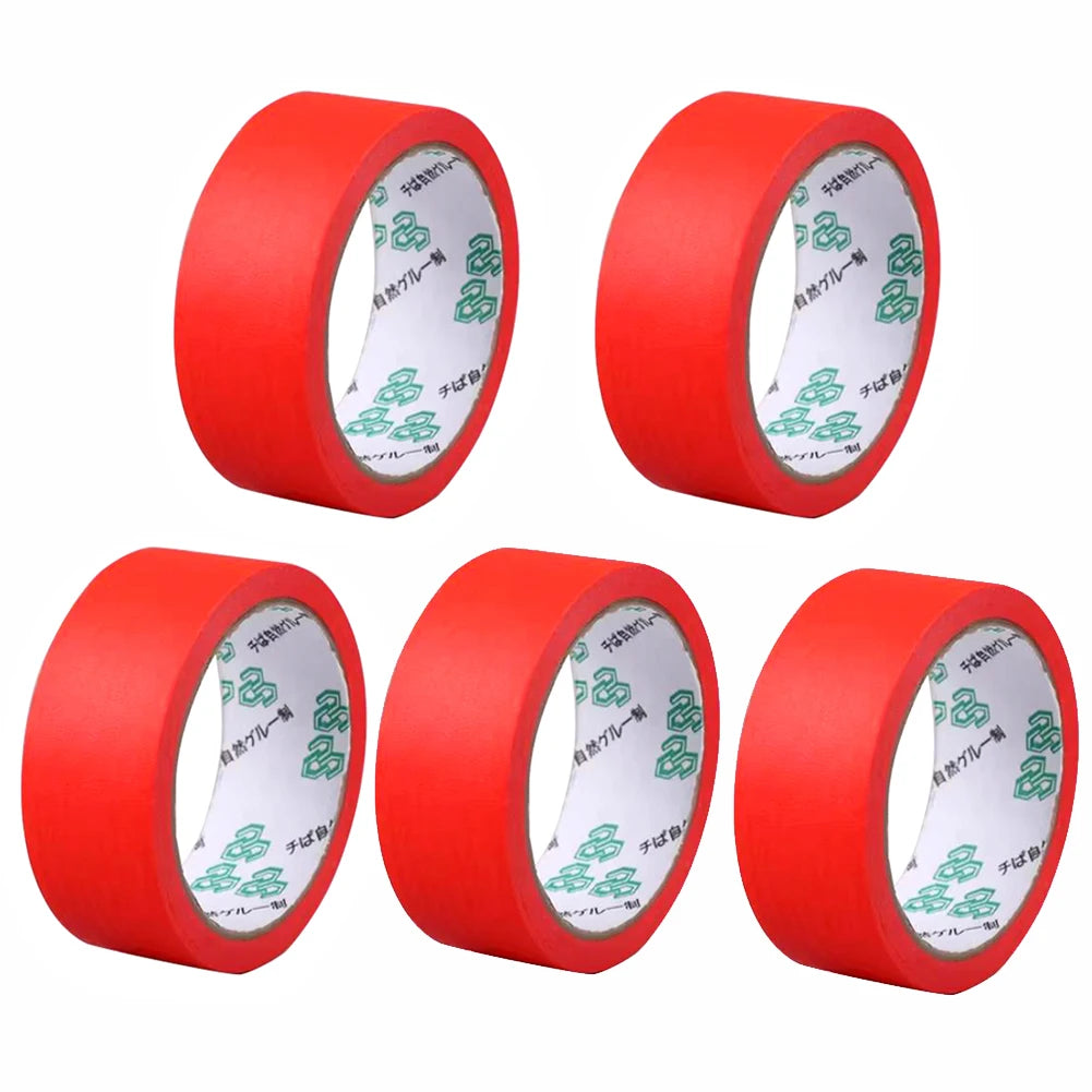 Three rolls of red painter's masking tape applicator shown from the side.