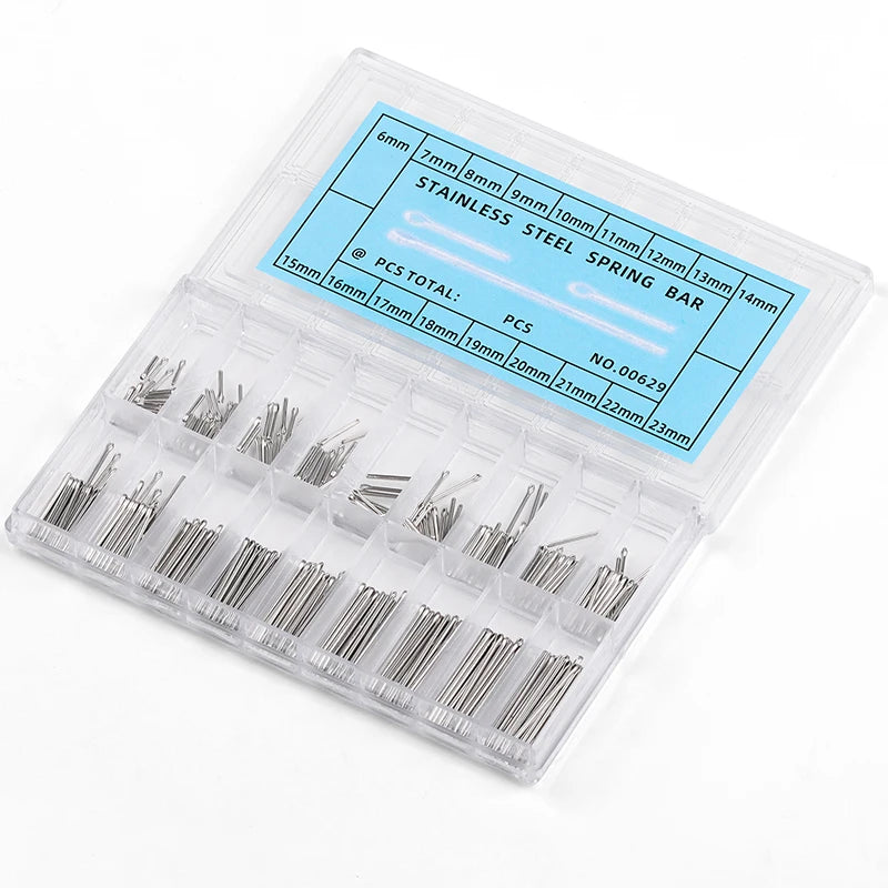 A clear plastic case containing various sizes of stainless steel split pins and connecting links for watch bands.