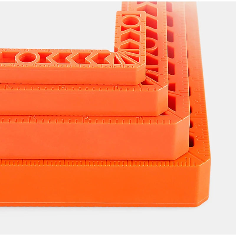 Orange plastic 90-degree angle positioner for woodworking, showing various angles and measurements.
