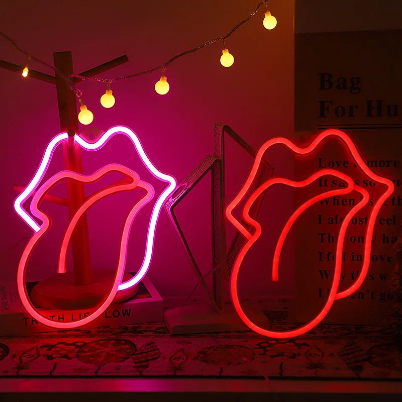 Neon heart lip light decoration glowing pink on a display stand with string lights