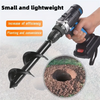 A hand is operating a black garden auger drill bit in the soil to create a planting hole.