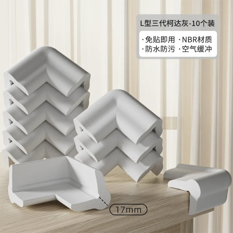 A set of L-shaped three-piece corner and table edge guards in white, showing the product's design and thickness.