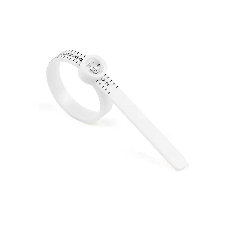 A white precision ring sizer with a magnifier is shown against a white background.