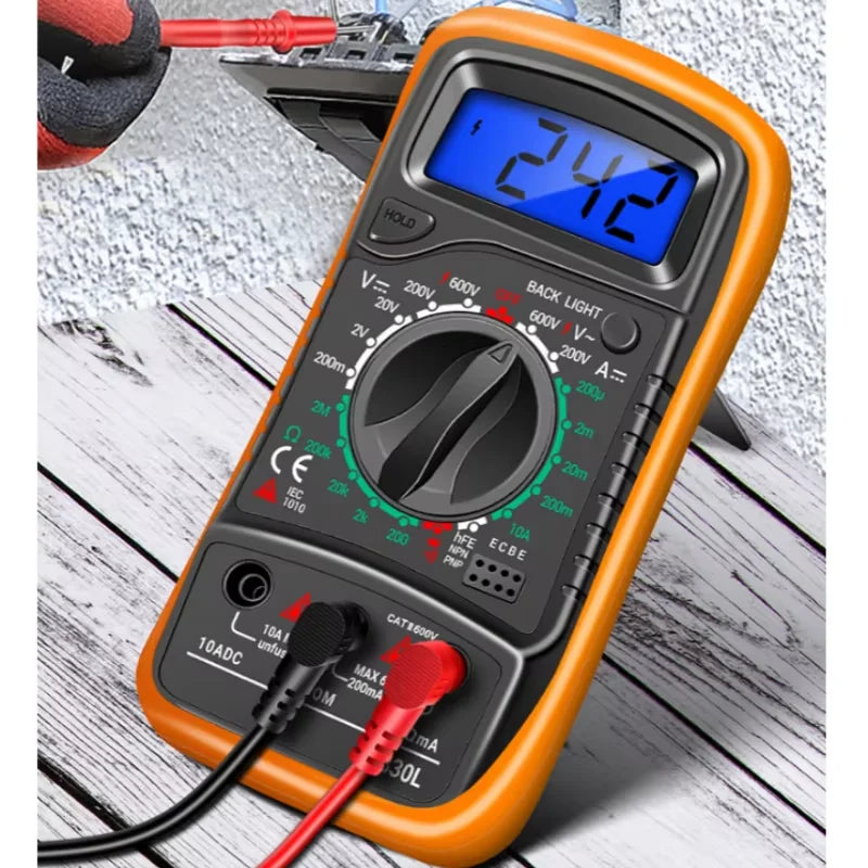 An orange handheld digital multimeter with a blue display and various test leads is shown on a wooden surface.