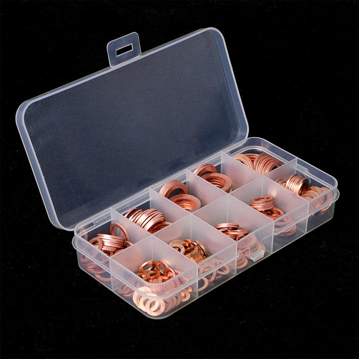 An open clear plastic box containing a set of copper gaskets and washers.