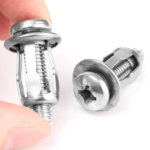 A hand holds a stainless steel expansion rivet nut, showing its threaded and expanded form.