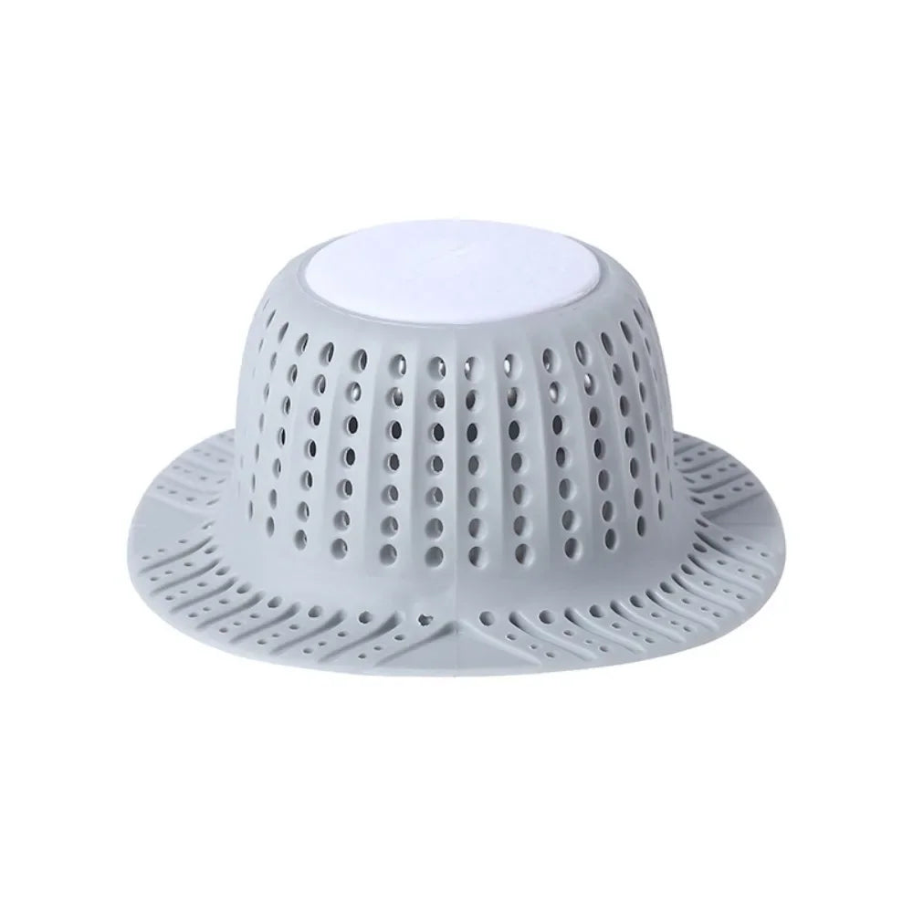 A white, collapsible bathtub drain hair catcher protector with a perforated dome and wide base.