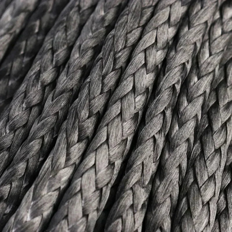 Close-up texture of a dark gray heavy-duty synthetic tow strap woven into a thick rope.