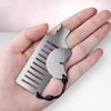 A hand holds a portable door lock for travel and security, featuring a metal strip and a curved piece.