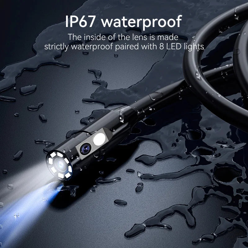 An industrial borescope camera with an LED light is shown shining a beam onto water droplets on a dark surface.