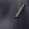 A close-up view of a black high temperature quenching needle used for breaking hard stone.