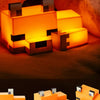 An officially licensed MC Game cute fox night light and desk lamp with an orange glow.