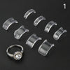 A set of clear plastic invisible ring sizing adjusters and a diamond ring are displayed on a black background.