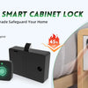A hand uses a fingerprint scanner on a smart cabinet lock to access a wooden cabinet.