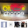 Neon sign displaying the words Oil change in yellow and red light for automotive decor