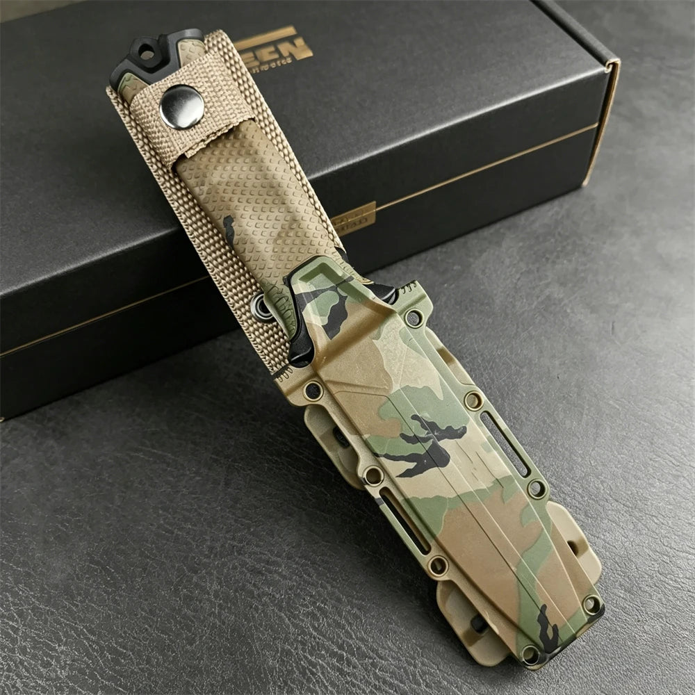A full tang fixed blade knife with a camouflage handle and blade resting on a dark surface.