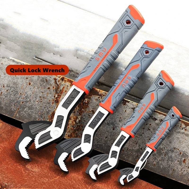 A set of orange and gray quick lock wrenches with serrated tips resting on a metal surface.