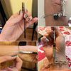 A hand holds a precision jewelry clasp helper tool used to open or close jewelry clasps.