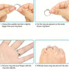 Hands demonstrate how to use adjuster pads to resize a ring band.