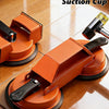 An orange floor gap repair tool with suction cups is shown on a wooden floor.