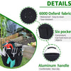 Black fabric storage basket with six pockets and an aluminum handle shown in a garden setting