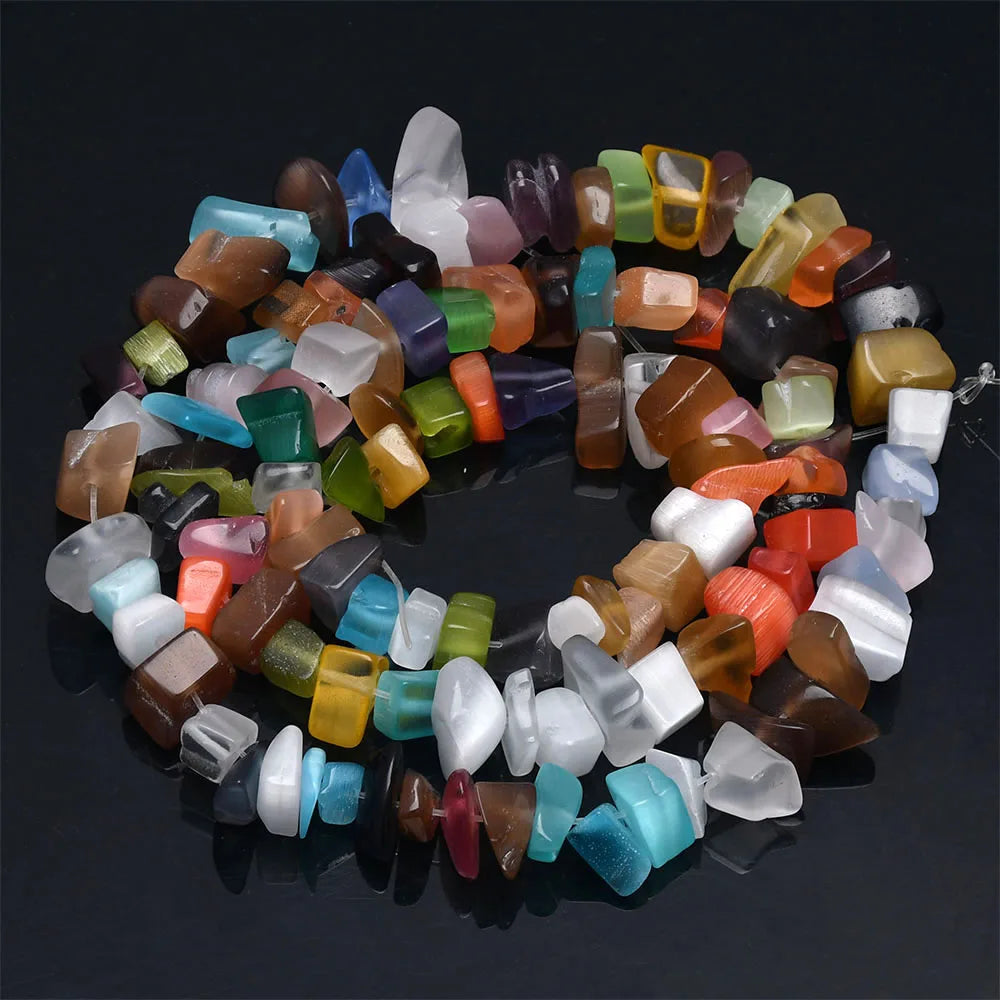 A circular arrangement of natural stone agate beads in various colors and shades for DIY jewelry making