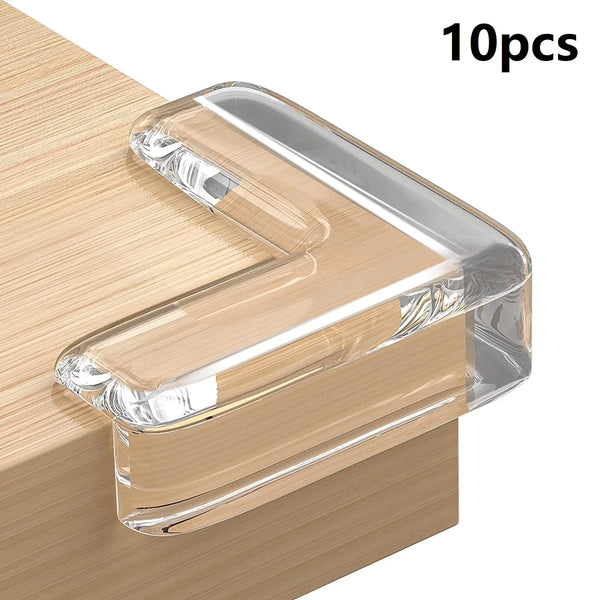 Ten silicone clear corner edge guards used for baby safety placed on a wooden surface.