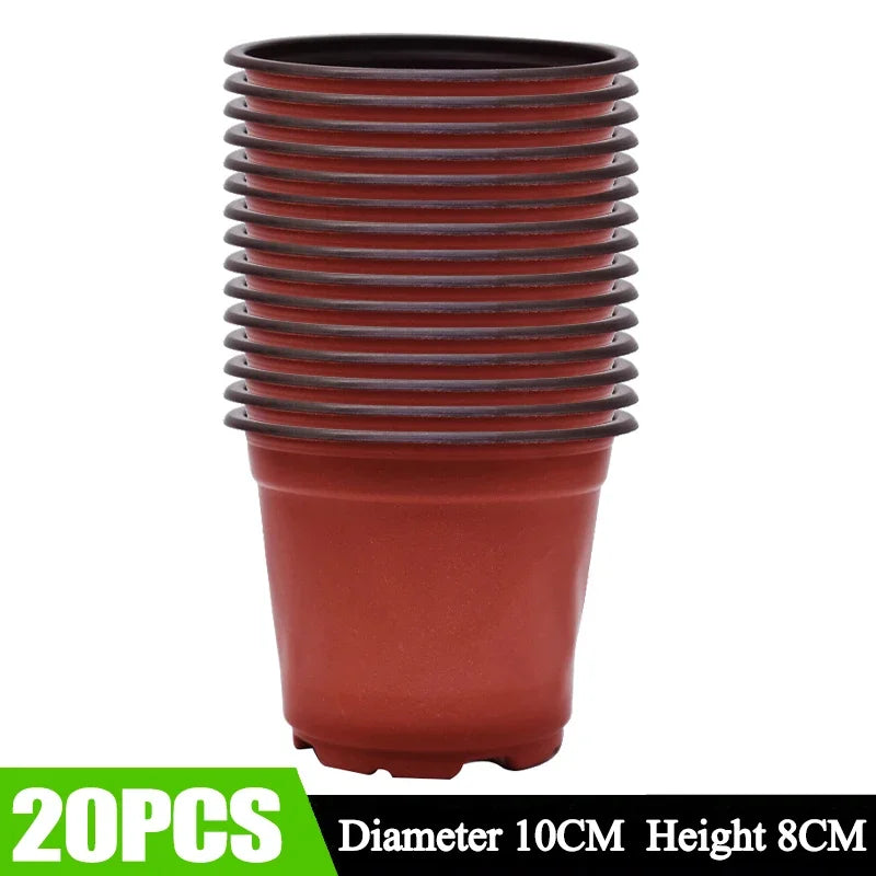 A stack of reddish-brown plastic nursery pots with ribbed sides and a smooth bottom.