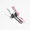 A set of black precision double torsion springs with varying lengths and diameters shown against a white background.