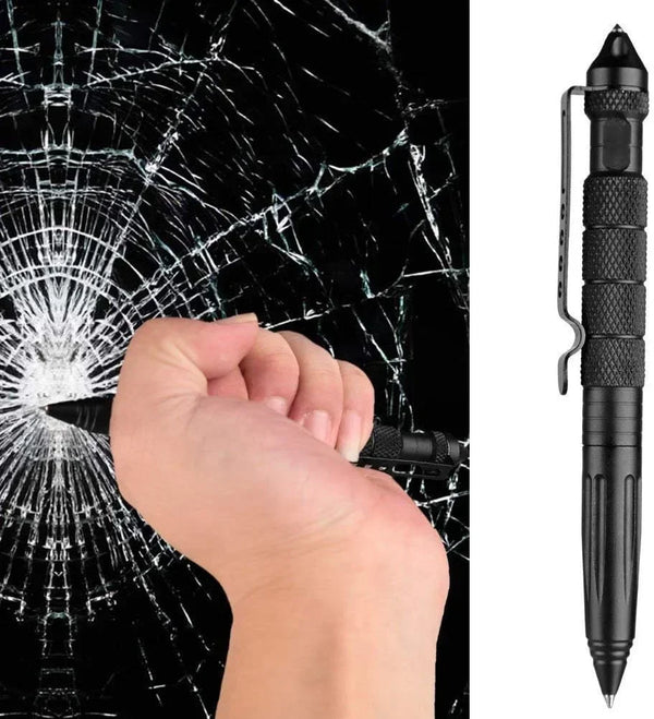 Schwarze taktische Selbstverteidigungspen neben einer Hand, die ein Spinnwebenmuster auf einer dunklen Oberfläche bricht.