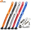 A set of five motorcycle side stand kickstand kits in various colors including orange, black, silver, red, and blue.