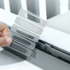 A hand holds a clear window screen repair patch kit with multiple mesh patches for fixing window screens.