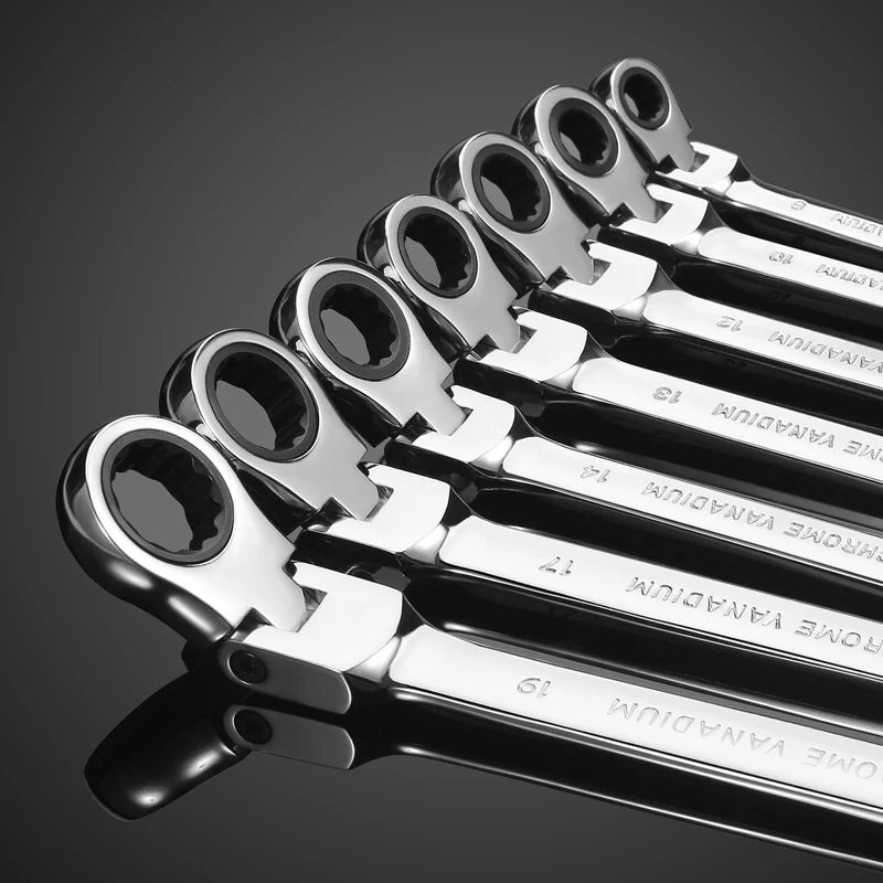 A close-up view of a set of chrome vanadium steel ratcheting wrenches arranged diagonally.