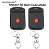 A black remote for a multi-code garage door system with two transmitter units and metal key rings.
